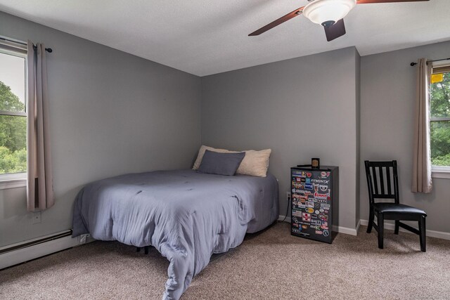309 Russo Dr, Hamden, CT 06518 - bedroom featuring light carpet, a baseboard radiator, and ceiling fan