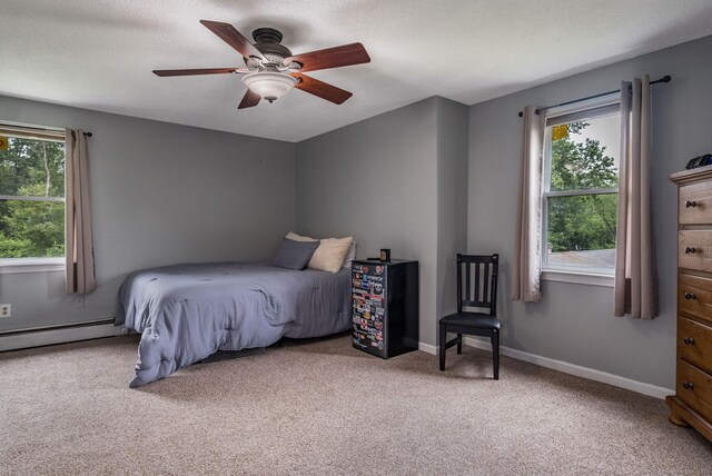 309 Russo Dr, Hamden, CT 06518 - bedroom featuring a baseboard radiator, carpet, and ceiling fan