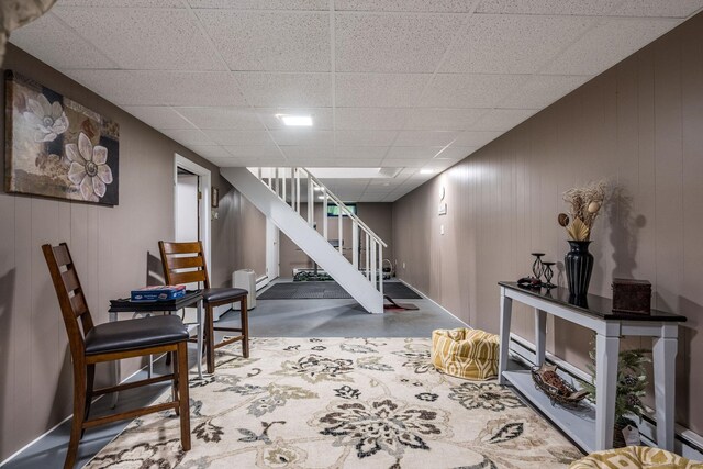 309 Russo Dr, Hamden, CT 06518 - sitting room with stairway, concrete flooring, and a drop ceiling