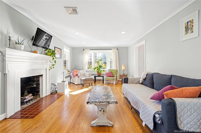 154 Mohawk Dr, West Hartford, CT 06117 - living room with wood finished floors, ornamental molding, recessed lighting, and a fireplace