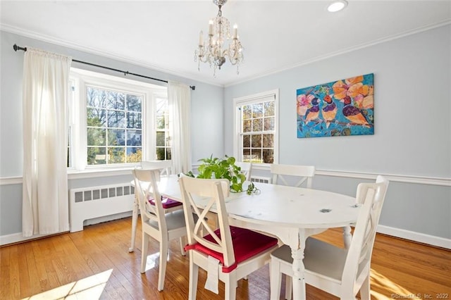 154 Mohawk Dr, West Hartford, CT 06117 - dining room with radiator, a chandelier, crown molding, hardwood / wood-style flooring, and recessed lighting