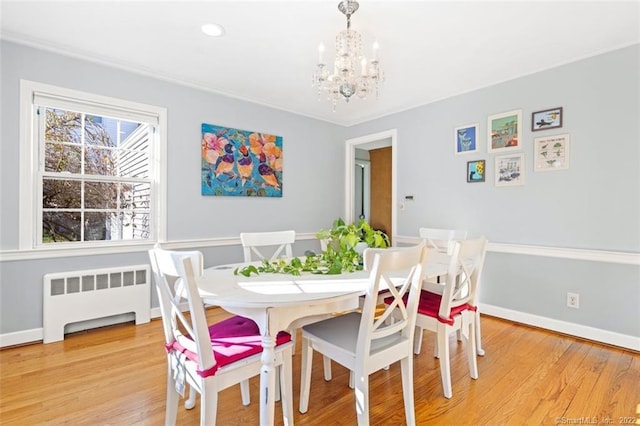 154 Mohawk Dr, West Hartford, CT 06117 - dining room featuring radiator, a chandelier, and light wood-type flooring