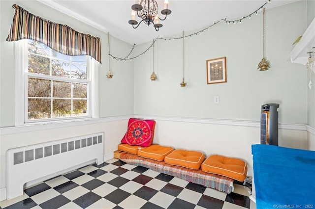 154 Mohawk Dr, West Hartford, CT 06117 - living area with radiator heating unit, tile patterned floors, and a chandelier