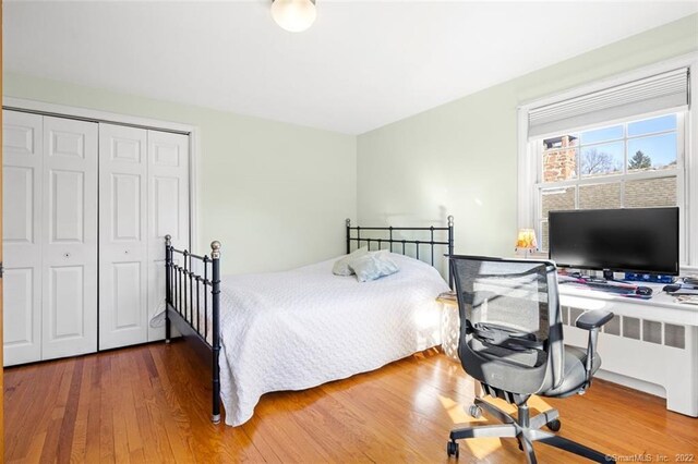 154 Mohawk Dr, West Hartford, CT 06117 - bedroom featuring wood finished floors, a closet, and a desk