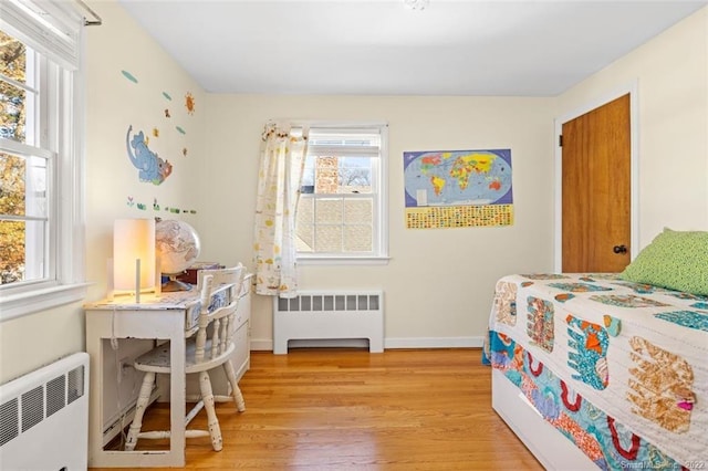 154 Mohawk Dr, West Hartford, CT 06117 - bedroom featuring radiator heating unit and light wood-type flooring