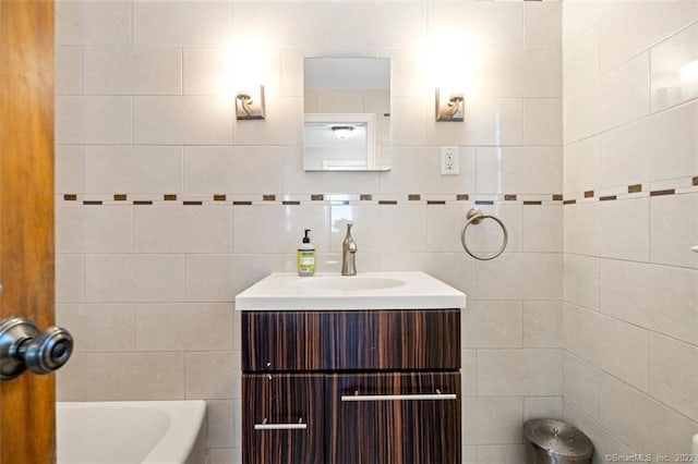 154 Mohawk Dr, West Hartford, CT 06117 - full bathroom featuring a tub to relax in, vanity, and tile walls