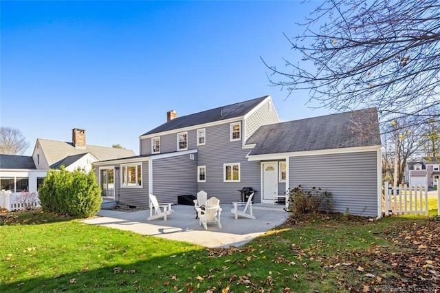 154 Mohawk Dr, West Hartford, CT 06117 - back of property featuring a patio area and a chimney