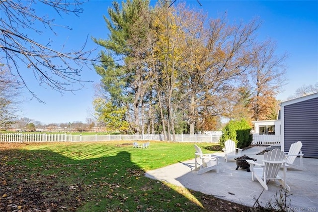 154 Mohawk Dr, West Hartford, CT 06117 - fenced backyard featuring a fire pit and a patio area
