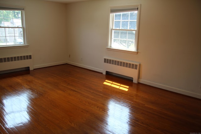 154 Mohawk Dr, West Hartford, CT 06117 - unfurnished room with radiator and hardwood / wood-style flooring
