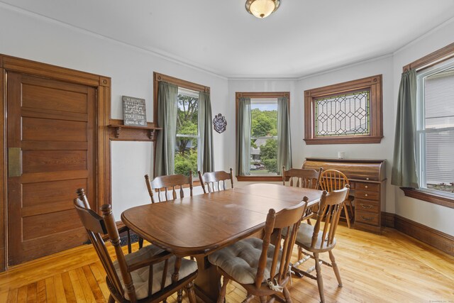 135 W Thames St, Norwich, CT 06360 - dining space featuring light wood finished floors and crown molding