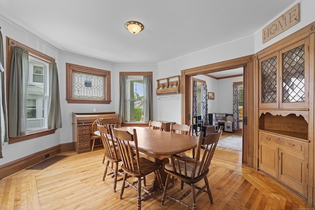 135 W Thames St, Norwich, CT 06360 - dining space featuring crown molding and light wood-style flooring