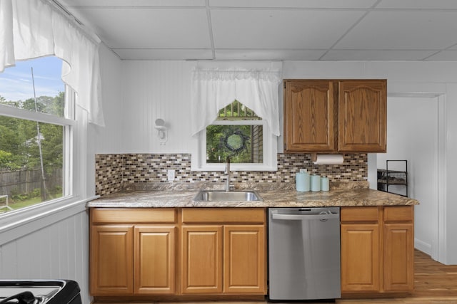 135 W Thames St, Norwich, CT 06360 - kitchen with stainless steel dishwasher, plenty of natural light, and backsplash