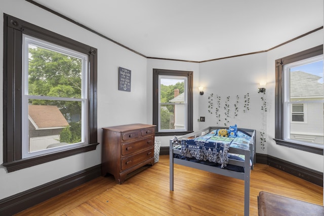 135 W Thames St, Norwich, CT 06360 - bedroom featuring light wood-type flooring and ornamental molding