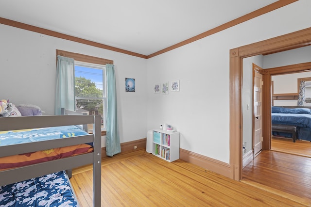 135 W Thames St, Norwich, CT 06360 - bedroom featuring wood finished floors and ornamental molding