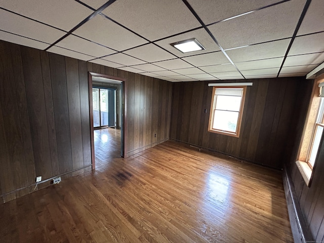 306 Divinity St, Bristol, CT 06010 - unfurnished room with a paneled ceiling, wood finished floors, and wood walls