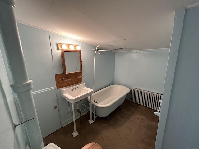 306 Divinity St, Bristol, CT 06010 - full bathroom with radiator, a freestanding bath, and vaulted ceiling