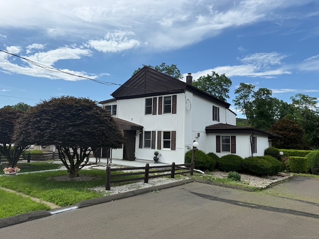 306 Divinity St, Bristol, CT 06010 - view of front of house featuring a chimney