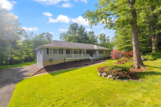 115 Remington Rd, Ridgefield, CT 06877 - single story home featuring covered porch, a front yard, and driveway