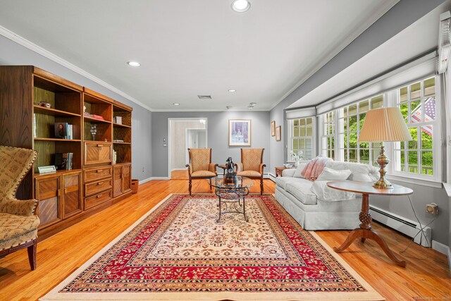 115 Remington Rd, Ridgefield, CT 06877 - living area with a baseboard heating unit, ornamental molding, light wood-style floors, and recessed lighting