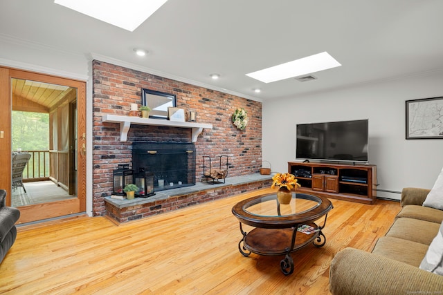 115 Remington Rd, Ridgefield, CT 06877 - living area featuring a skylight, a brick fireplace, wood finished floors, crown molding, and baseboard heating