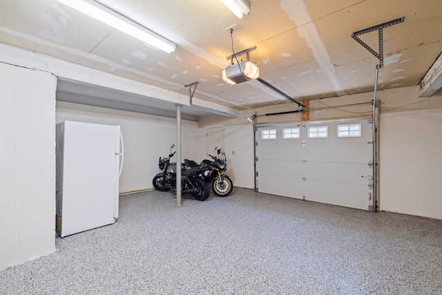 115 Remington Rd, Ridgefield, CT 06877 - garage with freestanding refrigerator and a garage door opener