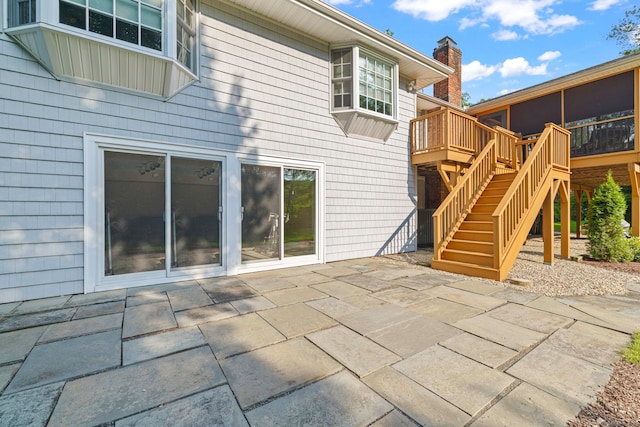 115 Remington Rd, Ridgefield, CT 06877 - back of house featuring a patio area, stairs, a wooden deck, and a sunroom