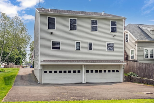 17 Glenwood Ave, Norwalk, CT 06854 - back of house featuring asphalt driveway and an attached garage