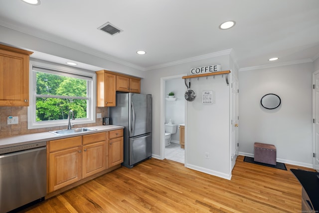 17 Glenwood Ave, Norwalk, CT 06854 - kitchen with appliances with stainless steel finishes, light countertops, decorative backsplash, light wood-type flooring, and recessed lighting