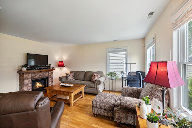 17 Glenwood Ave, Norwalk, CT 06854 - living area with light wood finished floors and a fireplace