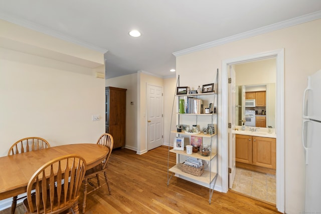 17 Glenwood Ave, Norwalk, CT 06854 - dining space featuring crown molding, light wood-style flooring, and recessed lighting