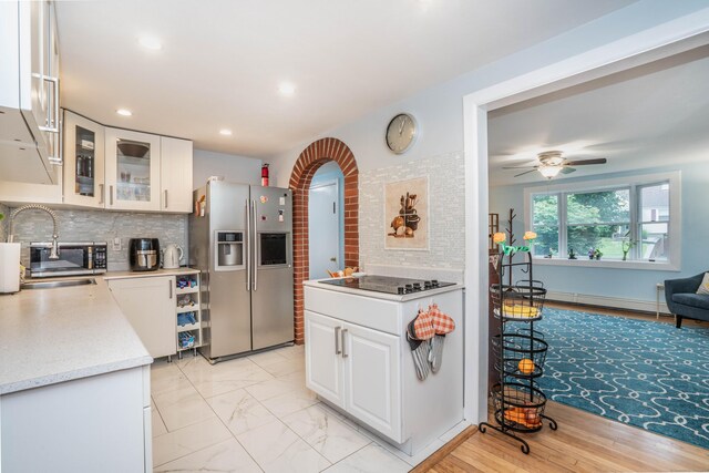 244 Stanwood Dr, New Britain, CT 06053 - kitchen with stainless steel fridge, black electric cooktop, light countertops, backsplash, and recessed lighting