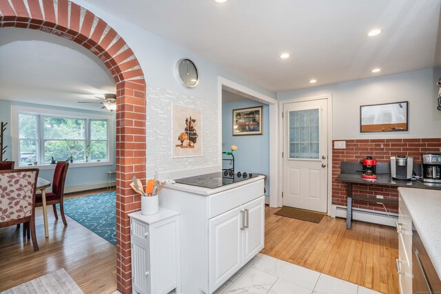 244 Stanwood Dr, New Britain, CT 06053 - kitchen with black electric stovetop, a baseboard radiator, white cabinets, recessed lighting, and ceiling fan