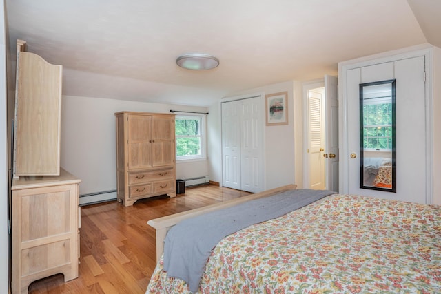 244 Stanwood Dr, New Britain, CT 06053 - bedroom featuring baseboard heating, light wood-style floors, and a closet