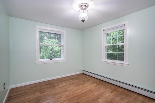 244 Stanwood Dr, New Britain, CT 06053 - empty room featuring a baseboard radiator and wood finished floors