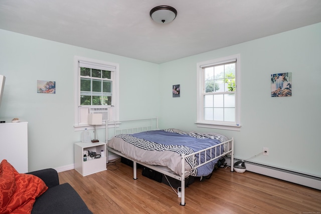 244 Stanwood Dr, New Britain, CT 06053 - bedroom featuring wood finished floors and a baseboard radiator