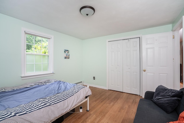 244 Stanwood Dr, New Britain, CT 06053 - bedroom featuring light wood-style flooring, a closet, and a baseboard heating unit