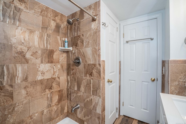244 Stanwood Dr, New Britain, CT 06053 - bathroom with a tile shower, wood finished floors, and vanity
