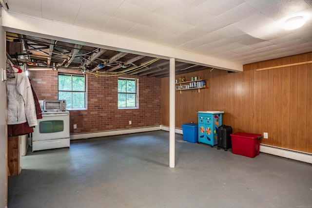 244 Stanwood Dr, New Britain, CT 06053 - basement with baseboard heating, wood walls, and brick wall