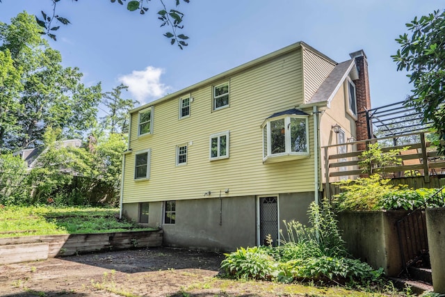 244 Stanwood Dr, New Britain, CT 06053 - back of property featuring a chimney