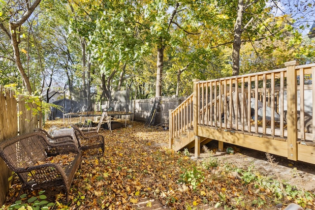 666 Orchard St, New Haven, CT 06511 - wooden terrace with a trampoline and a fenced backyard