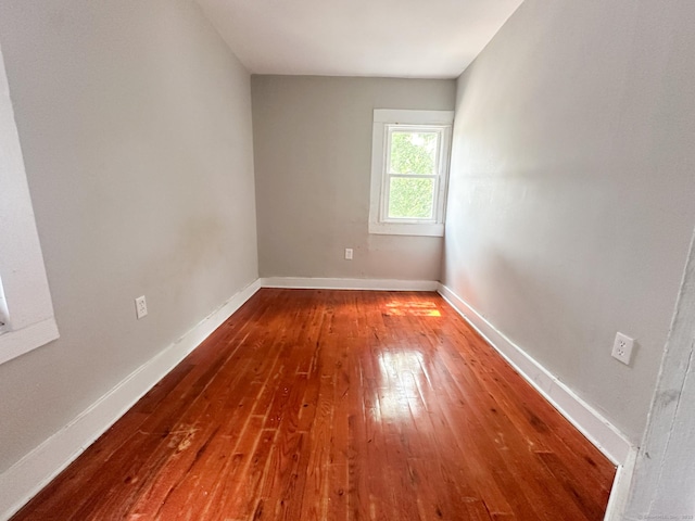 666 Orchard St, New Haven, CT 06511 - empty room with hardwood / wood-style flooring and baseboards