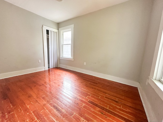 666 Orchard St, New Haven, CT 06511 - empty room with wood finished floors and baseboards