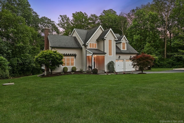 7 Forest View Dr, Newtown, CT 06482 - view of front of home with driveway, a chimney, a lawn, and a garage