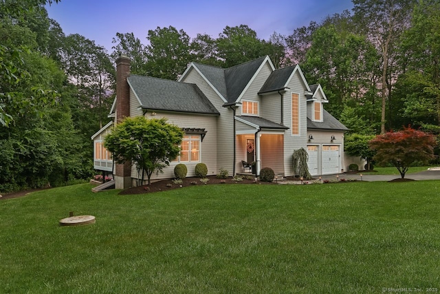 7 Forest View Dr, Newtown, CT 06482 - view of front of property with concrete driveway, a front yard, a chimney, a garage, and a shingled roof