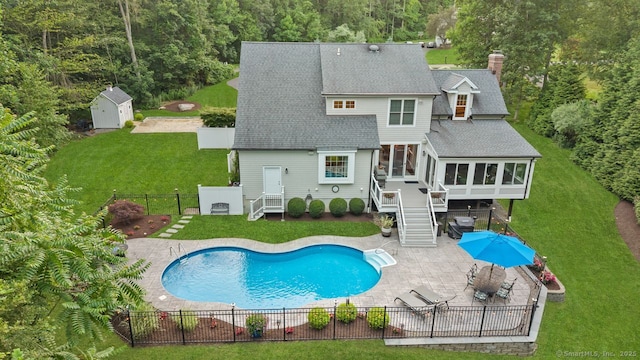 7 Forest View Dr, Newtown, CT 06482 - back of property featuring a sunroom, roof with shingles, a fenced backyard, a patio, and a shed