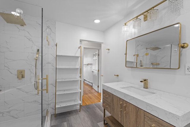 94 Prospect Ave, West Haven, CT 06516 - bathroom with a marble finish shower, vanity, a baseboard radiator, and recessed lighting