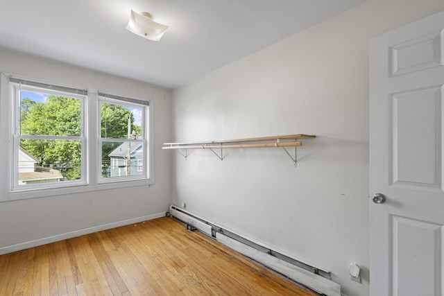 94 Prospect Ave, West Haven, CT 06516 - spare room featuring a baseboard heating unit and light wood-style floors