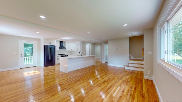 32 Miles Standish Dr, West Hartford, CT 06107 - unfurnished living room with light wood-type flooring, healthy amount of natural light, stairs, and recessed lighting