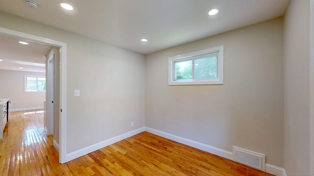 32 Miles Standish Dr, West Hartford, CT 06107 - empty room with a smoke detector, plenty of natural light, light wood finished floors, and recessed lighting