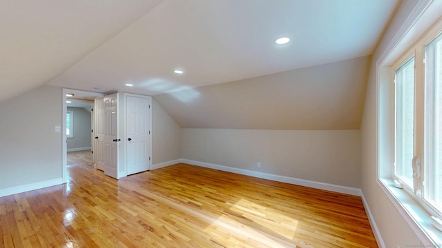 32 Miles Standish Dr, West Hartford, CT 06107 - additional living space featuring light wood-style floors, healthy amount of natural light, vaulted ceiling, and recessed lighting